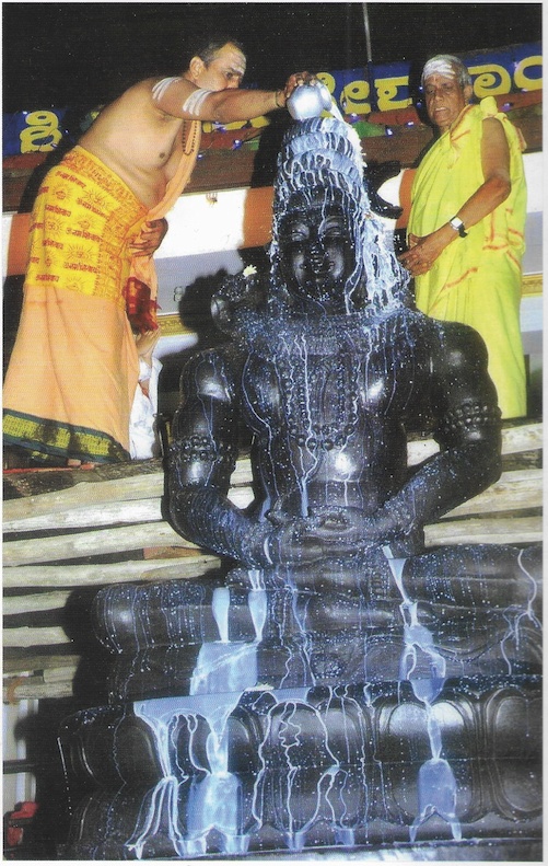 Sacred Abhishekam Ritual - Milk Abhishekam being performed on Lord Shiva